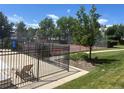 Community tennis courts perfect for exercise and socializing with neighbors and friends at 8771 Carr Loop, Arvada, CO 80005