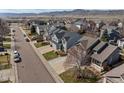 Wide aerial view of the neighborhood showcasing street, house, yard and surrounding homes at 8783 S Carr Way, Littleton, CO 80128