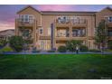 Inviting townhome with private balconies and a well-maintained lawn at 11250 Florence St # 22B, Commerce City, CO 80640