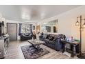 Comfortable living room with ample natural light and view of the outdoors at 1002 S Miller St, Lakewood, CO 80226