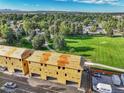 Aerial view of townhouses under construction near a park at 6643 W 52Nd Ave # C, Arvada, CO 80002