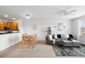 Open living space with dining area, comfortable seating and great natural light at 1761 S Buchanan Cir, Aurora, CO 80018