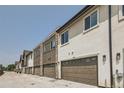 Attached garages with modern doors for multiple townhouses at 388 E Orchard Rd, Centennial, CO 80121