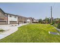 Community green space with well-maintained lawn and walking path at 388 E Orchard Rd, Centennial, CO 80121