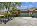 Exterior view with stucco siding, and a well-manicured front yard at 1024 Cottonwood Cir, Golden, CO 80401