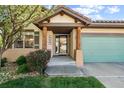 Charming home entrance featuring natural wood accents and a cozy, landscaped garden at 1024 Cottonwood Cir, Golden, CO 80401