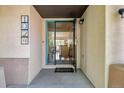 Welcoming front porch view featuring a charming home doormat at 1024 Cottonwood Cir, Golden, CO 80401