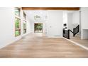 Bright living area with light wood floors, wood beam and access to the yard at 655 Cree Cir, Boulder, CO 80303