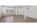Spacious living room with natural light and attractive floors at 7245 Goldbloom Ln, Littleton, CO 80125
