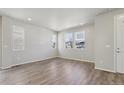 Bright and spacious living room area boasting gleaming floors and lots of natural light at 7245 Goldbloom Ln, Littleton, CO 80125