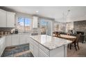 Bright, modern kitchen with granite countertops and an open floor plan at 3378 Shoveler Trl, Castle Rock, CO 80104