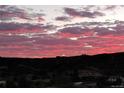 Beautiful sunset illuminating a tranquil mountain range at 3378 Shoveler Trl, Castle Rock, CO 80104