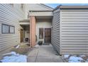 Townhome entrance featuring a security door, outdoor plants, and side door access at 748 Ridgeside Dr, Golden, CO 80401