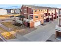 Two-story house with an attached garage, second-floor deck, and a small covered porch at 18028 French Creek Ave, Parker, CO 80134