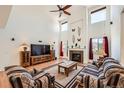Bright, open living room with high ceilings, fireplace and an abundance of natural light at 17456 Quarry Way, Monument, CO 80132
