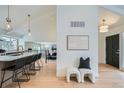 Bright and airy entryway with modern decor and hardwood floors at 2133 S Parfet Dr, Lakewood, CO 80227