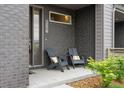 Cozy front porch with chairs, offering a welcoming outdoor space and stylish curb appeal at 928 Cimarron Dr # C, Lafayette, CO 80026