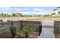 Fenced front yard providing a private outdoor space with minimal landscaping, offering views of surrounding neighborhood at 928 Cimarron Dr # C, Lafayette, CO 80026