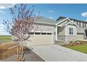 Charming single-Gathering home featuring stone accents, a two-car garage, and a well-maintained yard at 1957 S Coolidge Way, Aurora, CO 80018