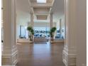 An elegant foyer leads to a spacious living room with amazing views of mountains beyond at 93 Glenmoor Dr, Cherry Hills Village, CO 80113