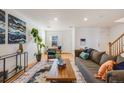 Open living room featuring hardwood floors and ample natural light at 410 Smith Cir, Erie, CO 80516