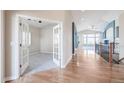 Inviting foyer featuring hardwood floors, a study and entry to the living room at 8802 E 148Th Ln, Thornton, CO 80602