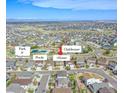Aerial view showcases community layout with pool, clubhouse, park, and neighborhood at 22441 E Chenango Dr, Aurora, CO 80015