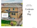 Backyard features a covered patio at 22441 E Chenango Dr, Aurora, CO 80015