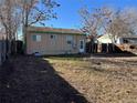 Fenced backyard featuring a mostly bare lawn, ready for landscaping and outdoor enjoyment at 7870 Magnolia St, Commerce City, CO 80022