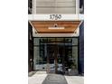 Exterior entrance to the building featuring modern architecture and clear signage at 1750 Wewatta St # 740, Denver, CO 80202