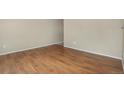 Empty room with hard wood floors and light colored walls at 15650 E Eldorado Dr, Aurora, CO 80013