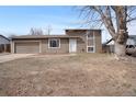 Charming two-story home with attached garage and front yard at 15650 E Eldorado Dr, Aurora, CO 80013