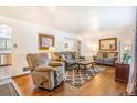 Cozy living room with hardwood floors, comfortable seating, and natural light at 111 S Eaton St, Lakewood, CO 80226