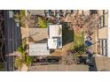 Aerial view shows a home with patio, yard with small trees, surrounded by other homes and a narrow street at 1749 Boulder St, Denver, CO 80211