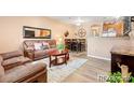 Cozy living room featuring comfortable seating, a coffee table, and modern decor at 833 E 98 Ave # 204, Thornton, CO 80229