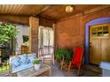 Charming front porch featuring comfortable seating and a warm, welcoming atmosphere with a lovely decor at 1160 York St, Denver, CO 80206