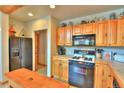Functional kitchen featuring wooden cabinets, modern appliances, and ample counter space for meal preparation at 812 High Point Dr, Breckenridge, CO 80424