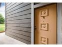 Close-up of an apartment door with decorative raised design at 18103 E Kentucky Ave # 103, Aurora, CO 80017
