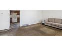Living room adjacent to kitchen awaiting personalization at 1536 S Field Ct, Lakewood, CO 80232