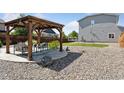 Relax in this backyard oasis featuring a charming pergola and lush landscaping, perfect for outdoor entertaining and relaxation at 25106 E 1St Ave, Aurora, CO 80018