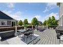 Spacious outdoor deck, perfect for entertaining, with stylish furniture and a grill at 25106 E 1St Ave, Aurora, CO 80018