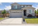 Charming two-story home featuring stone accents, a two-car garage, and a well-manicured front lawn at 25106 E 1St Ave, Aurora, CO 80018