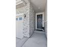 Inviting front entrance with stylish stone accents and a charming wreath, creates a warm welcome to this beautiful home at 25106 E 1St Ave, Aurora, CO 80018