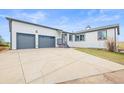 Charming home featuring a large, attached two-car garage and convenient front driveway at 2845 Cherry Way, Parker, CO 80138