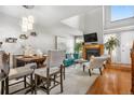 Inviting living room featuring a fireplace, open dining area, and ample natural light, ideal for gatherings at 5155 W 68Th Ave # 5, Westminster, CO 80030