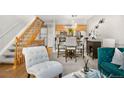 Living room with wooden stairs, modern decor, and a comfortable seating area at 5155 W 68Th Ave # 5, Westminster, CO 80030