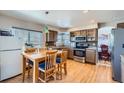 Kitchen with stainless steel appliances and wood cabinets at 5416 S Gray St, Littleton, CO 80123