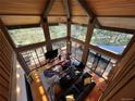 Overhead view of open concept living room with wood ceilings and floors, and bright natural light at 24226 Currant Dr, Golden, CO 80401