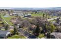Overhead view showcases this home's peaceful neighborhood with mature trees, green lawns, and convenient street access at 2949 Vivian St, Wheat Ridge, CO 80215