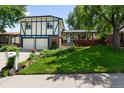 Charming two-story home with well-maintained lawn, lush landscaping, and a two-car garage at 10520 W 101St Pl, Westminster, CO 80021